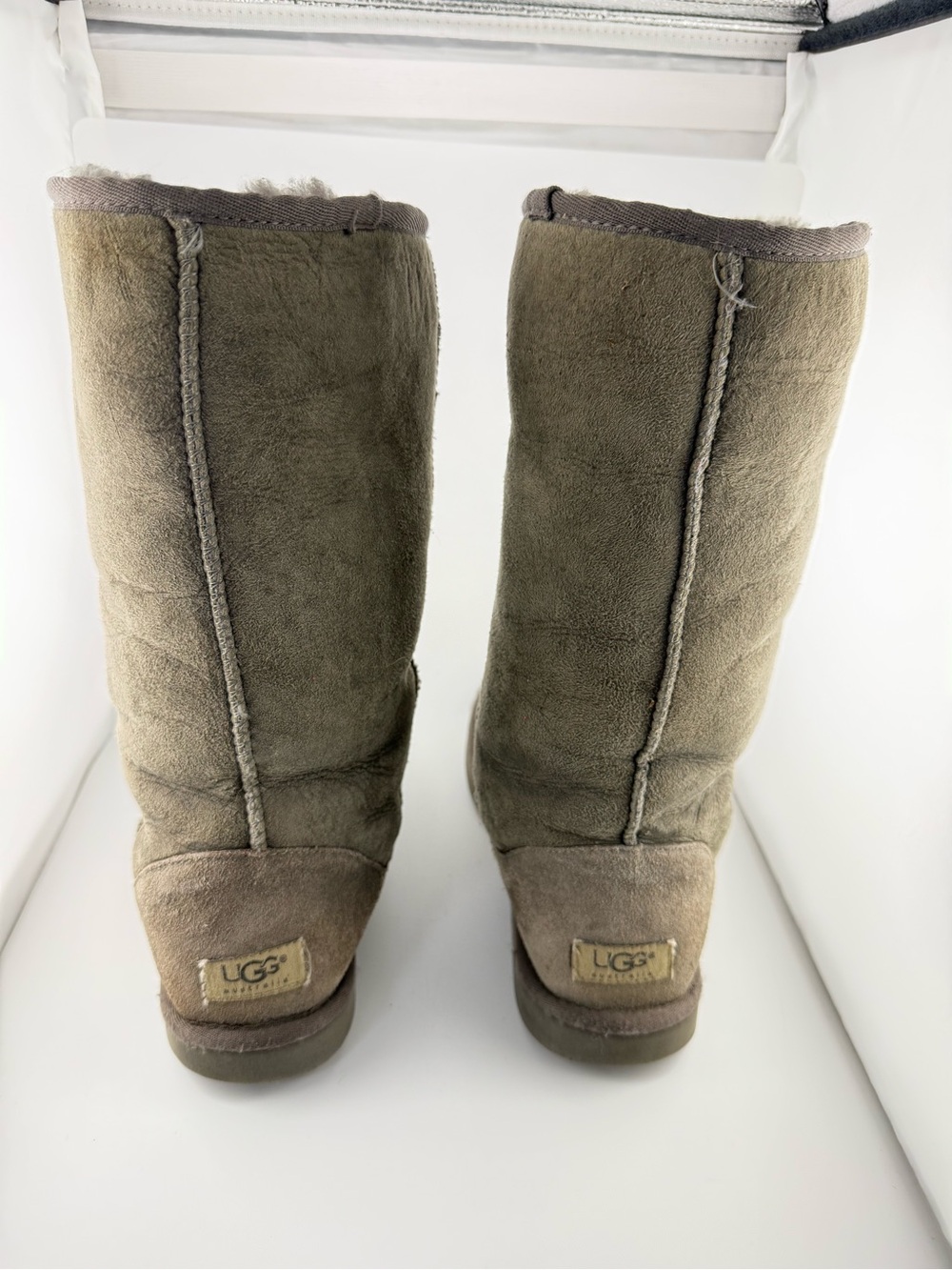 Pair of UGG Classic Tall boots in a women's size 8 Gray